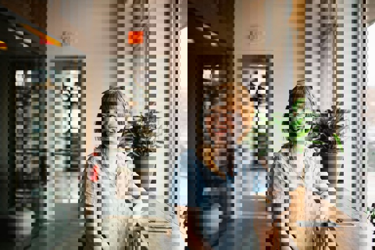 Smiling woman by a window